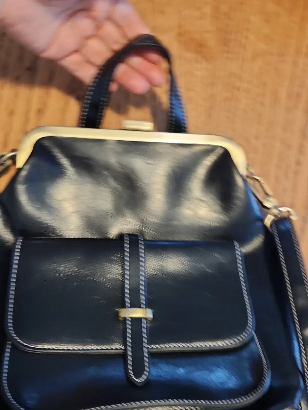Structured Black Leather Backpack with Gold-Tone Frame